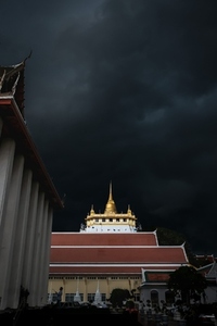 Golden mountain in Wat Saket Bangkok Thailand covered with dark Golden mountain in Wat Saket Bangkok Thailand covered with dark