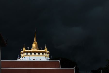 Golden mountain in Wat Saket Bangkok Thailand covered with dark Golden mountain in Wat Saket Bangkok Thailand covered with dark