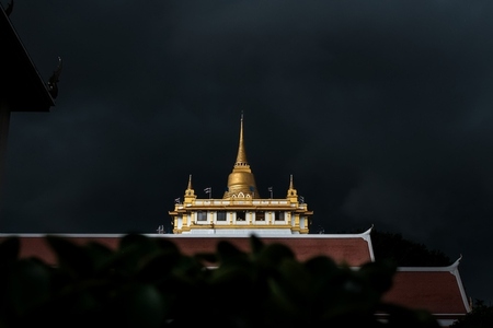 Golden mountain in Wat Saket Bangkok Thailand covered with dark Golden mountain in Wat Saket Bangkok Thailand covered with dark