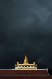 Golden mountain in Wat Saket Bangkok Thailand covered with dark Golden mountain in Wat Saket Bangkok Thailand covered with dark