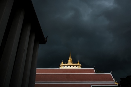 Golden mountain in Wat Saket Bangkok Thailand covered with dark Golden mountain in Wat Saket Bangkok Thailand covered with dark