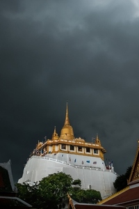 Golden mountain in Wat Saket Bangkok Thailand covered with dark Golden mountain in Wat Saket Bangkok Thailand covered with dark