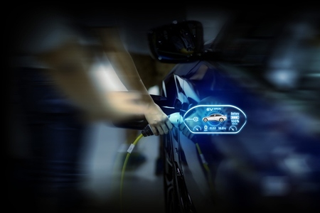 Power cable pump plug in charging power to electric vehicle EV c Power cable pump plug in charging power to electric vehicle EV c