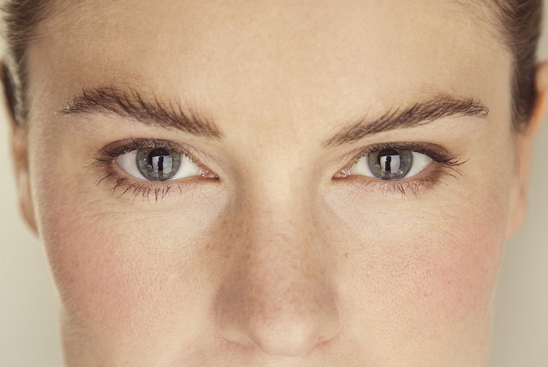 Close up portrait of beautiful woman with blue eyes