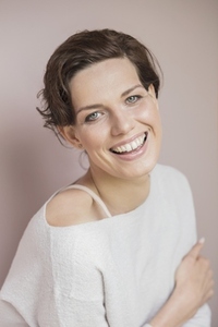 Formal portrait of beautiful happy young woman with short brown hair and blue eyes Formal portrait of beautiful happy young woman with short brown hair and blue eyes