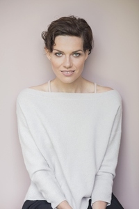 Portrait of beautiful confident woman with short brown hair and blue eyes