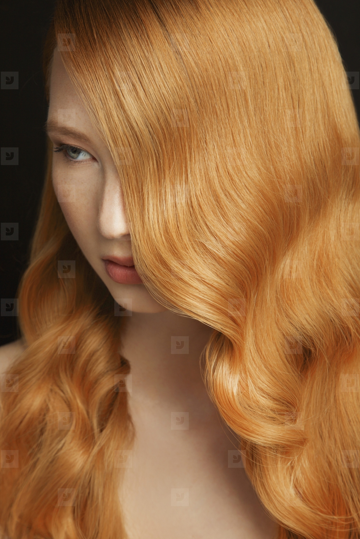 Formal portrait of beautiful young woman with shiny