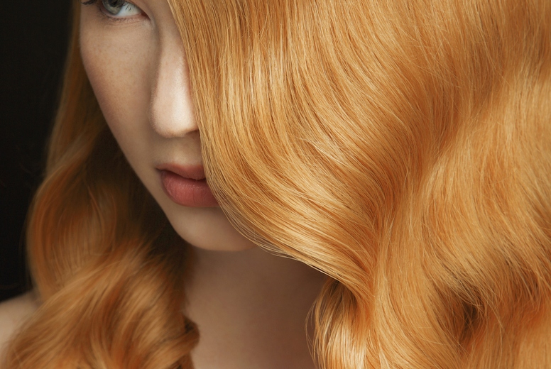 Formal portrait of beautiful young woman with shiny