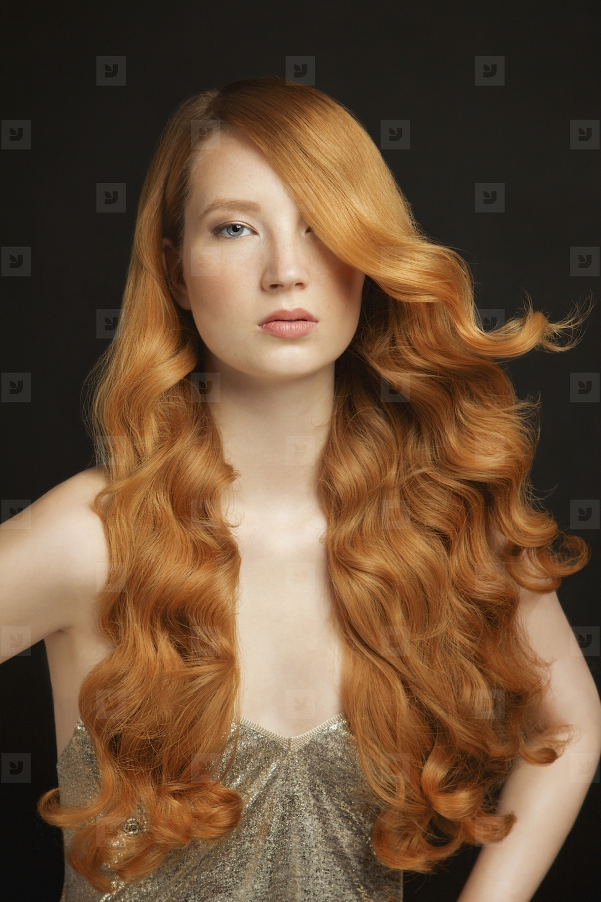 Studio portrait of beautiful young woman with wav