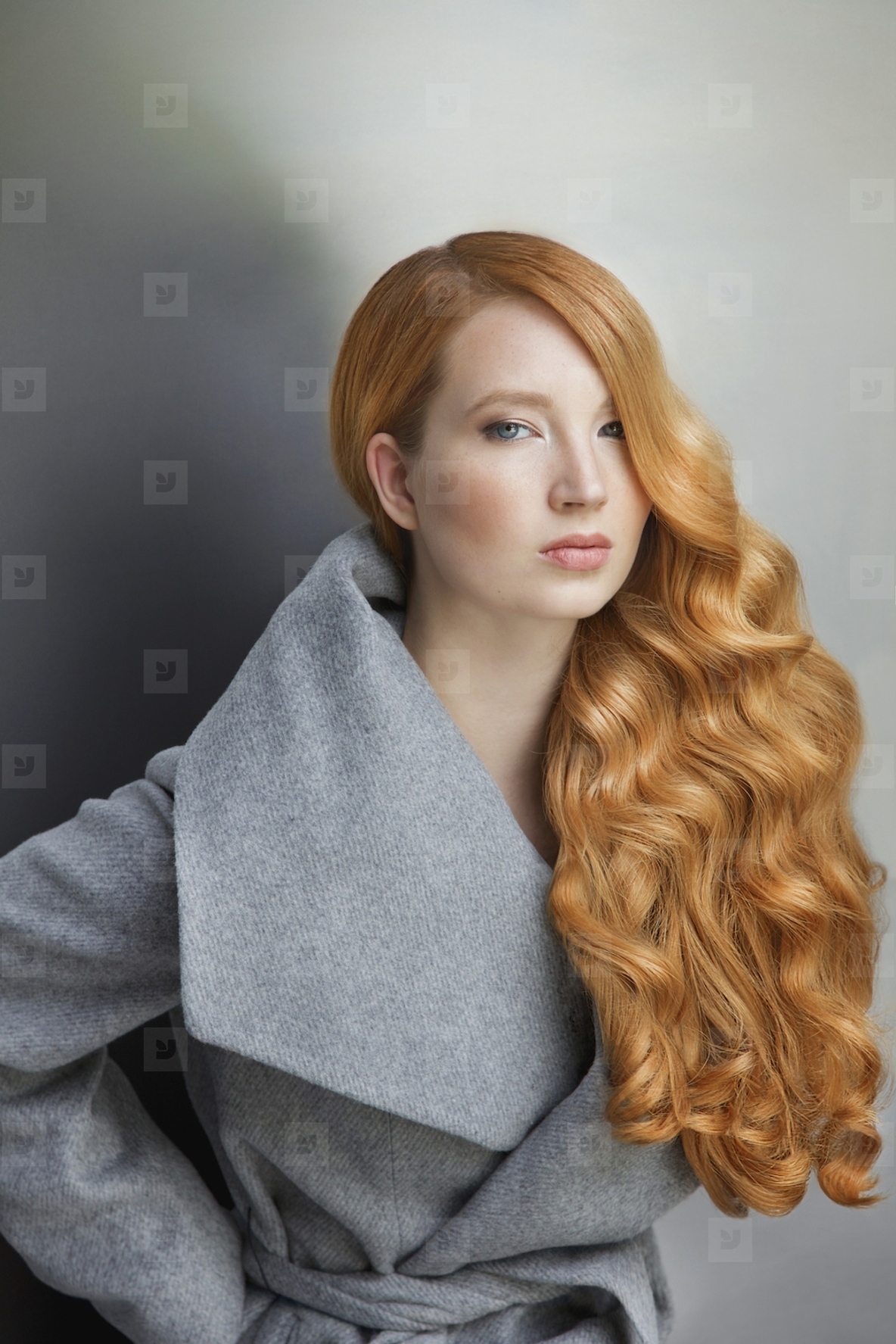 Studio portrait of confident beautiful young woman with long