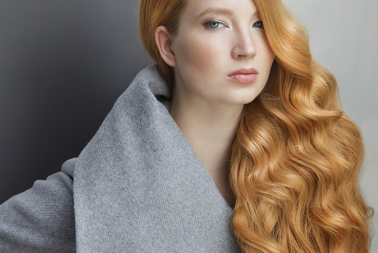 Studio portrait of confident beautiful young woman with long