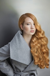 Studio portrait of confident beautiful young woman with long