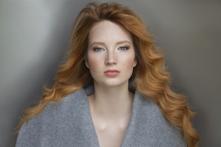 Formal portrait of beautiful young woman with wavy Formal portrait of beautiful young woman with wavy