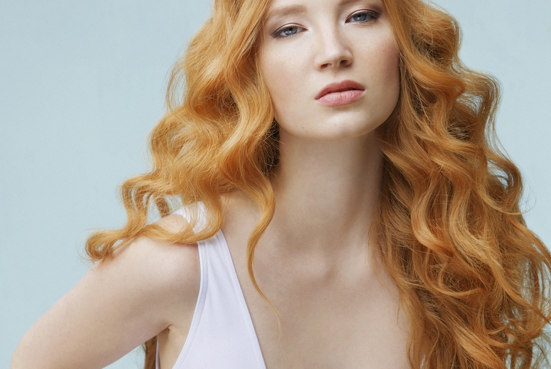 Formal portrait of beautiful sexy young woman with long