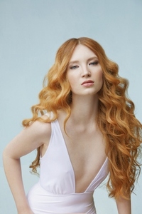 Formal portrait of beautiful sexy young woman with long