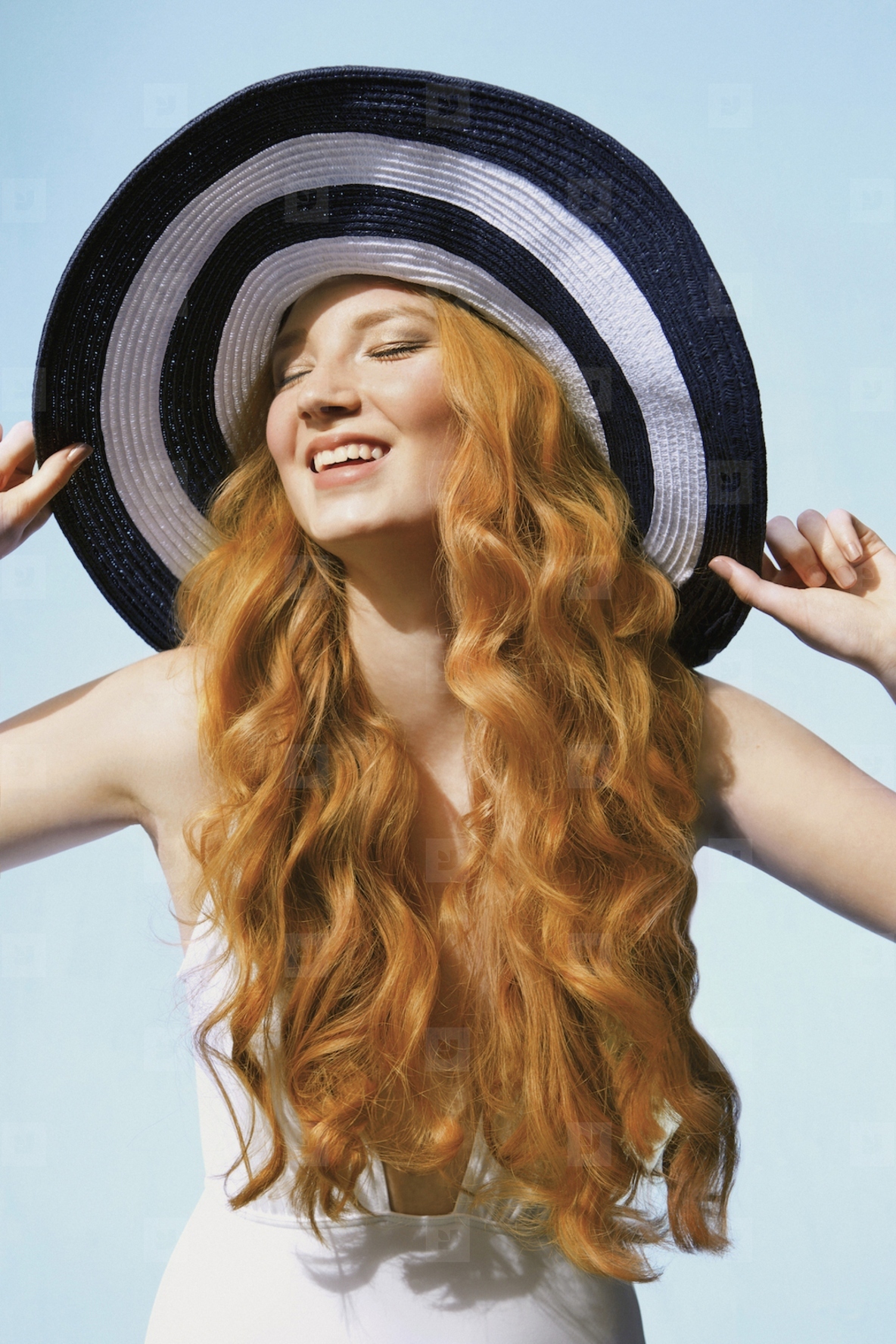 Portrait of carefree young woman with long