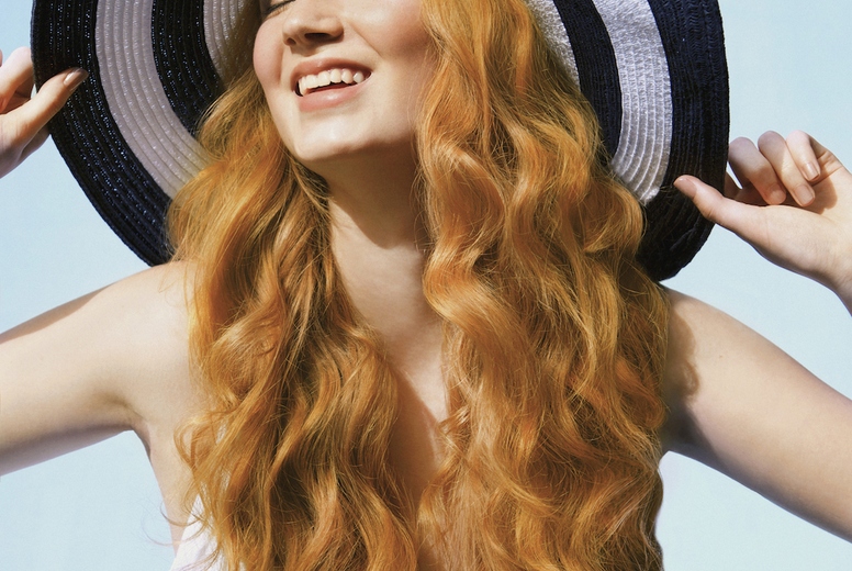 Portrait of carefree young woman with long