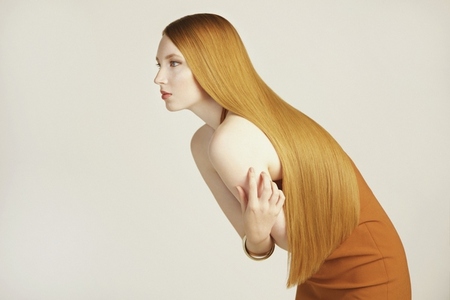 Studio portrait of beautiful young woman with long