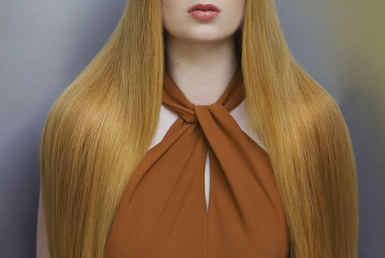 Formal portrait of beautiful young woman with long