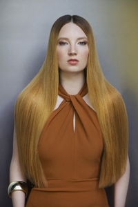 Formal portrait of beautiful young woman with long