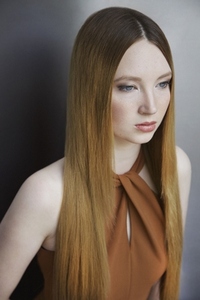 Studio portrait of beautiful young woman with long