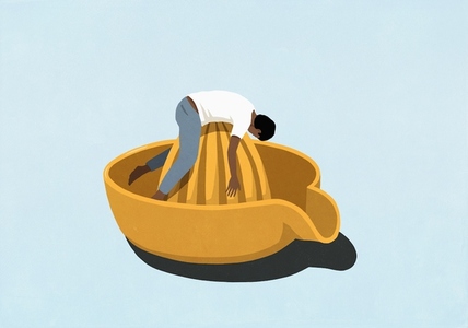 Man laying on top of large yellow citrus juicer against blue background