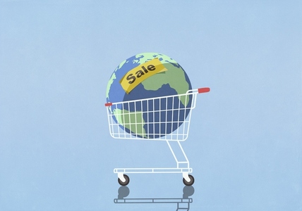 For Sale sign over large globe in shopping cart against blue background