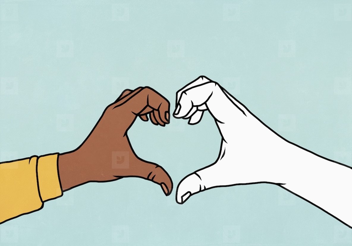 White and brown hands forming heart shape against blue background