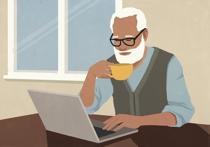 Senior man with beard drinking coffee and using laptop at home