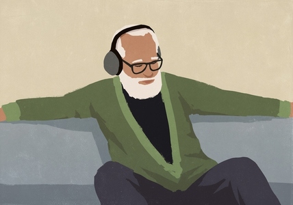 Senior man with beard relaxing sitting and listening to music with headphones and arms outstretched