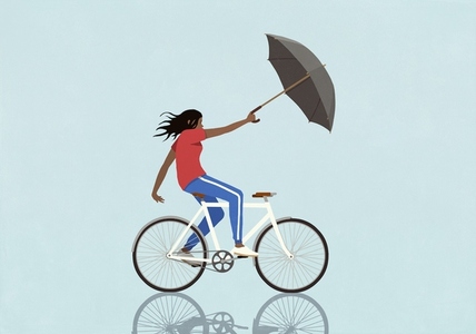 Wind pulling woman riding bicycle with umbrella on blue background