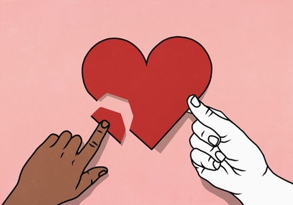 View from above of white and brown hands mending broken heart on pink background View from above of white and brown hands mending broken heart on pink background