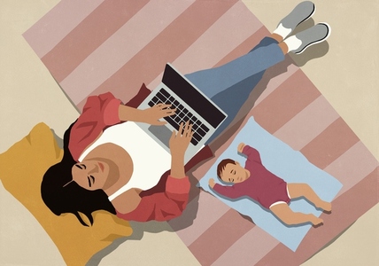 View from above of baby sleeping on floor next to mother working at laptop