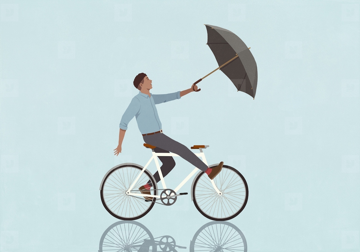 Wind pulling surprised man with umbrella riding bicycle on blue background
