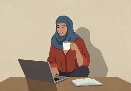 Muslim businesswoman in hijab drinking coffee and working Muslim businesswoman in hijab drinking coffee and working