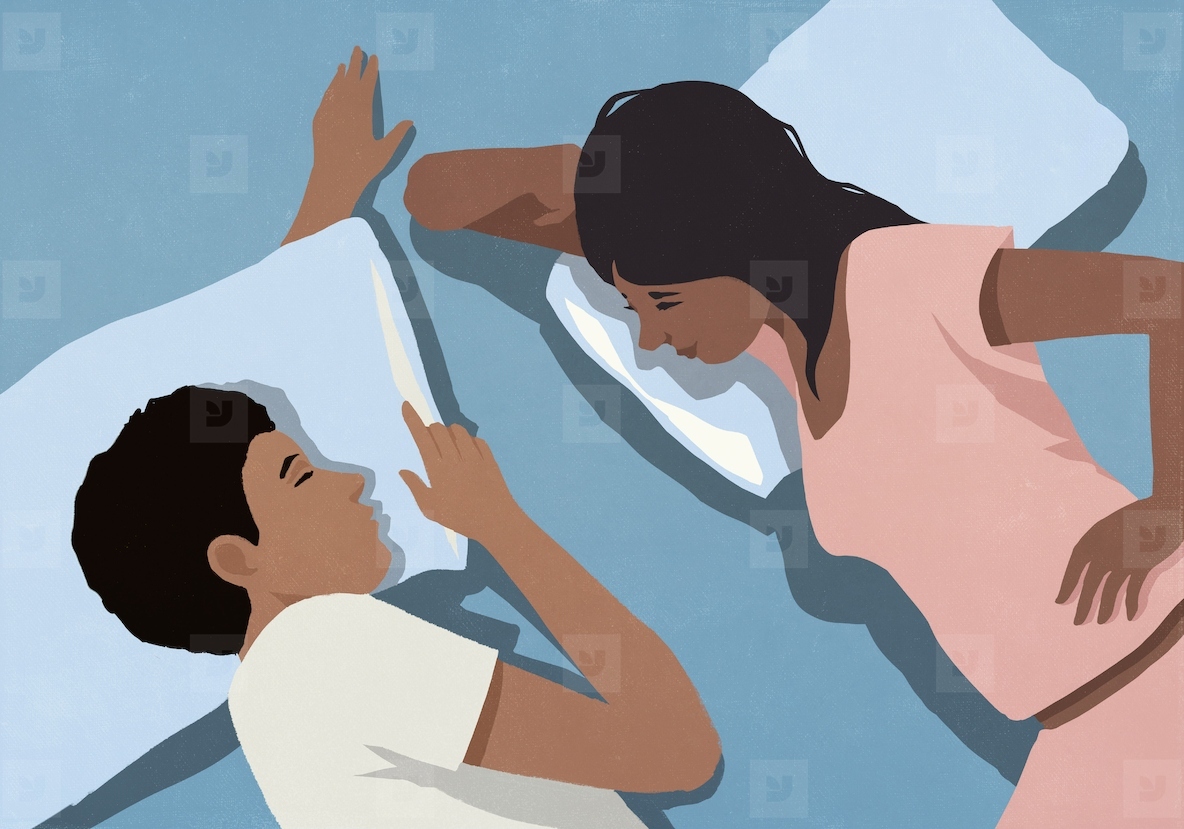 View from above of woman laying in bed