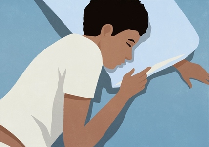 View from above of serene man sleeping on pillow in bed at night