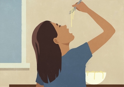 Woman with head back eating noodles with fork at home