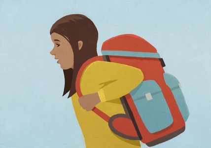 Side view of school girl with large backpack against blue background