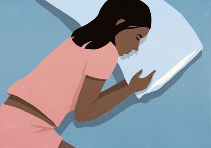 View from above of tired woman in pajamas sleeping on pillow in bed