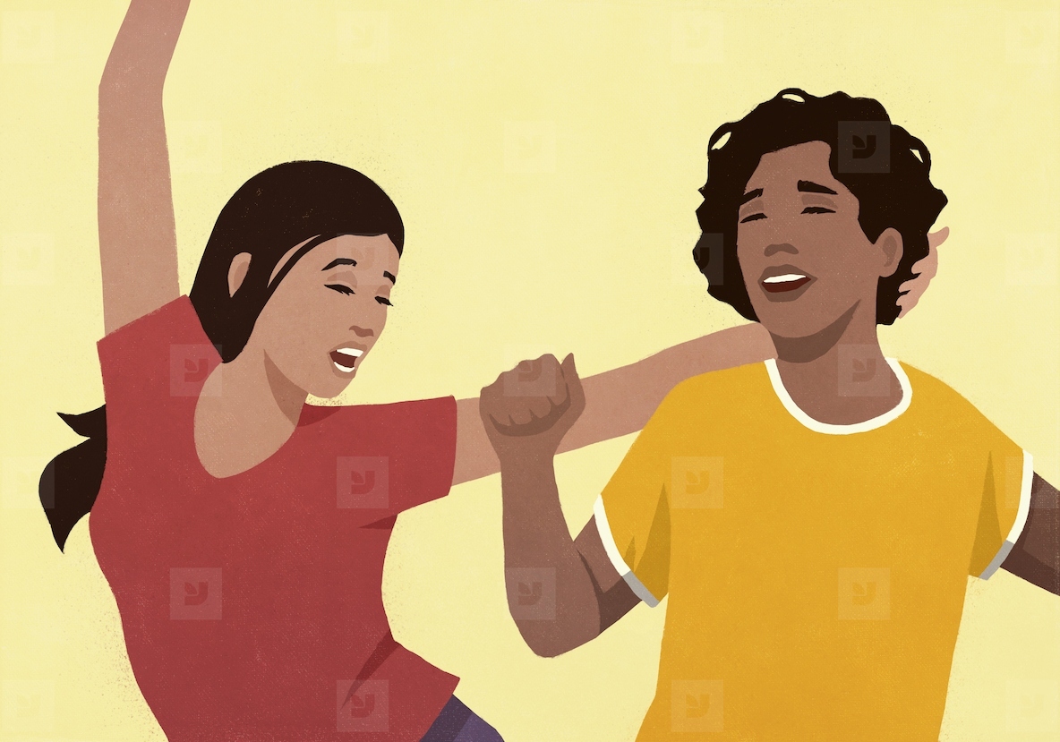 Carefree young women friends dancing against yellow background