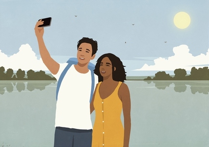 Happy young multiracial couple taking a selfie with smart phone on vacation at sunny summer lake