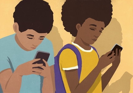 Schoolboy and schoolgirl using smart phones side by side Schoolboy and schoolgirl using smart phones side by side