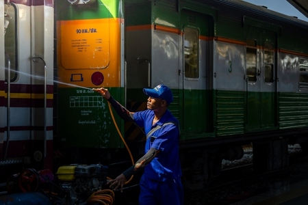 Bangkok  Thailand   March 3  Workers spray water to clean train