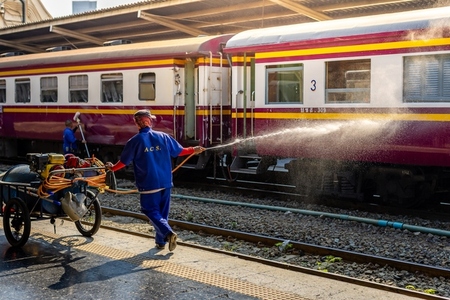 Bangkok  Thailand   March 3  Workers spray water to clean train