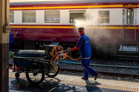 Bangkok  Thailand   March 3  Workers spray water to clean train