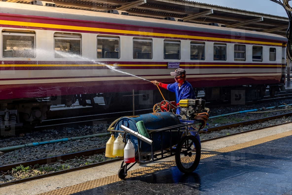 Bangkok  Thailand   March 3  Workers spray water to clean train