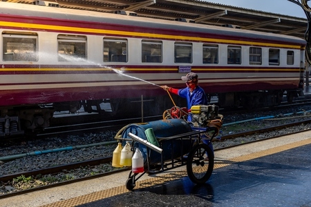 Bangkok  Thailand   March 3  Workers spray water to clean train