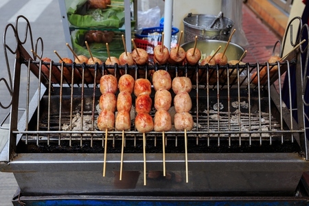 Thailand street food  Grilled Isaan sausages sold on streetsides