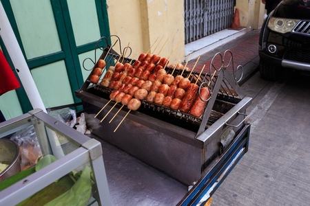 Thailand street food  Grilled Isaan sausages sold on streetsides